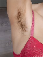 Nata plays naughty as she strips nude in a kitchen