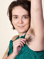 Harley enjoys her feet and hairy pussy while naked