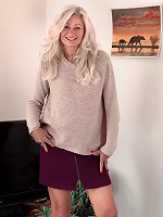 Ellen B poses in her ever short purple skirt